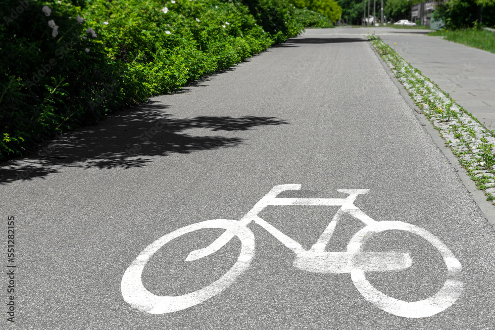 Obraz premium white sign on the pavement for the passage of cyclists bike path