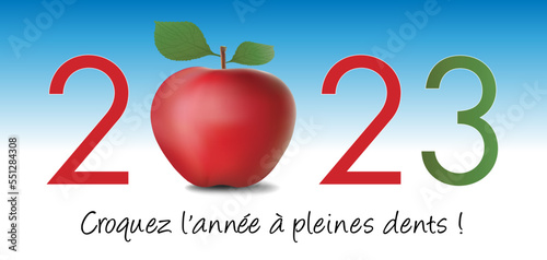 Carte de vœux pour le nouvel an 2023 montrant une pomme rouge, symbole de vie saine et diététique pour croquer la vie à pleine dents.