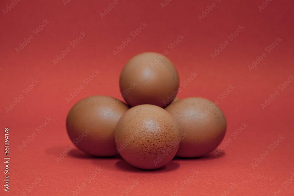 Brown Chicken eggs in carton box on Black background, Eggs with carton box in the background on black Brown Chicken eggs in carton box on Black background, Eggs with carton box in the background on black