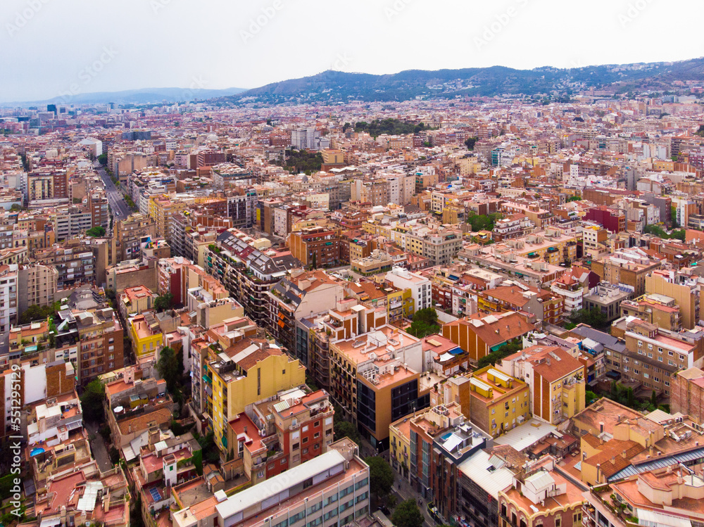 Φωτογραφία mass of roofs of houses on the spanish city of Barcelona