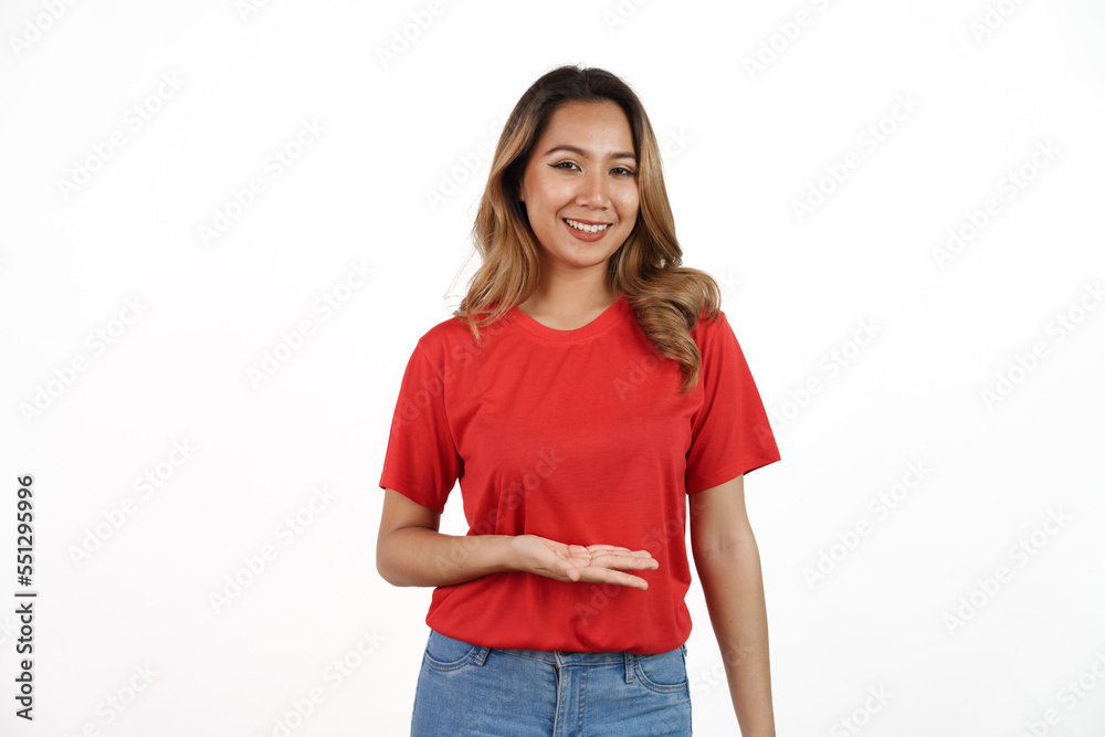 Studio shot of pretty Asian woman with red t-shirt isolated on white background. Palm up or holding product Studio shot of pretty Asian woman with red t-shirt isolated on white background. Palm up or holding product