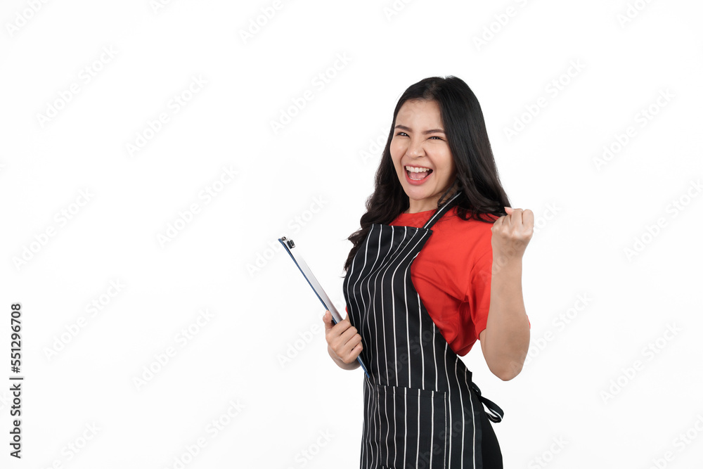Holding clipboard, Food shop owner concept, Smiling young confident asian woman in black apron and red t-shirt isolated on white background. Looking camera Holding clipboard, Food shop owner concept, Smiling young confident asian woman in black apron and red t-shirt isolated on white background. Looking camera