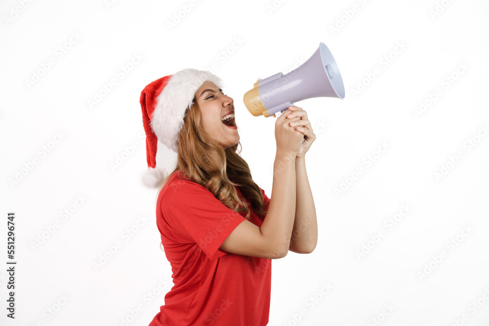 Happy asian woman in santa hat and red t-shirt isolated on white background. holding a megaphone Happy asian woman in santa hat and red t-shirt isolated on white background. holding a megaphone