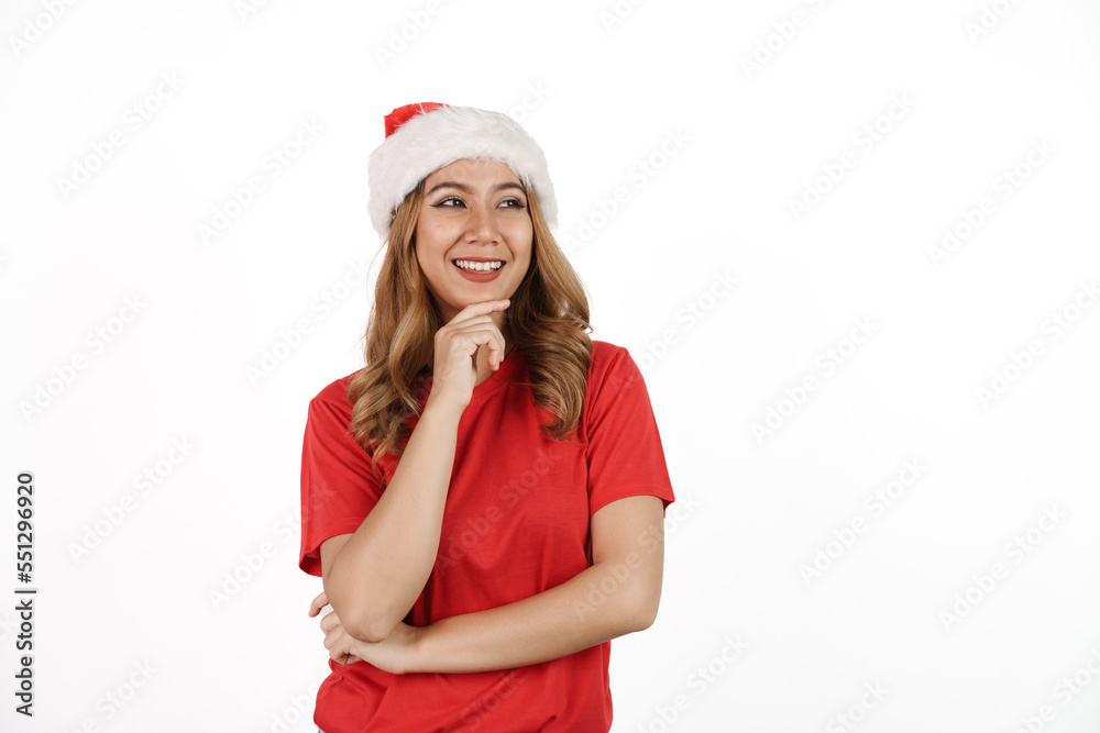 Happy asian woman in santa hat and red t-shirt isolated on white background. Happy asian woman in santa hat and red t-shirt isolated on white background.