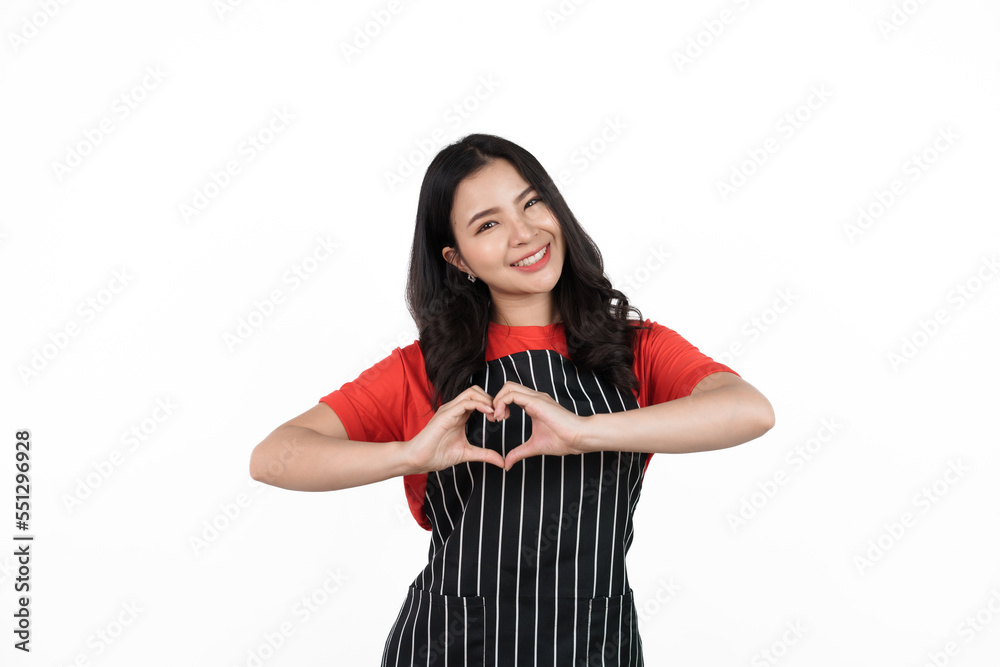 Heart Shape, Food shop owner concept, Smiling young confident asian woman in black apron and red t-shirt isolated on white background. Heart Shape, Food shop owner concept, Smiling young confident asian woman in black apron and red t-shirt isolated on white background.