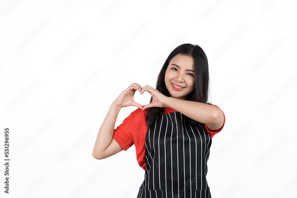 Heart Shape, Food shop owner concept, Smiling young confident asian woman in black apron and red t-shirt isolated on white background. Heart Shape, Food shop owner concept, Smiling young confident asian woman in black apron and red t-shirt isolated on white background.