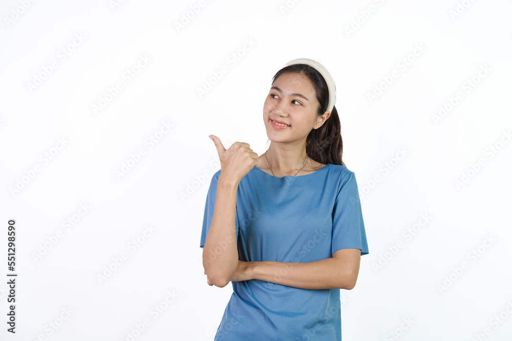 Beautiful Asian woman in blue t-shirt isolated on white background. Hands pointing for advertise or discount Beautiful Asian woman in blue t-shirt isolated on white background. Hands pointing for advertise or discount