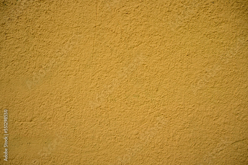 Abstract contemporary texture background. Yellow texture for designer background. Colorful old dirty wall.