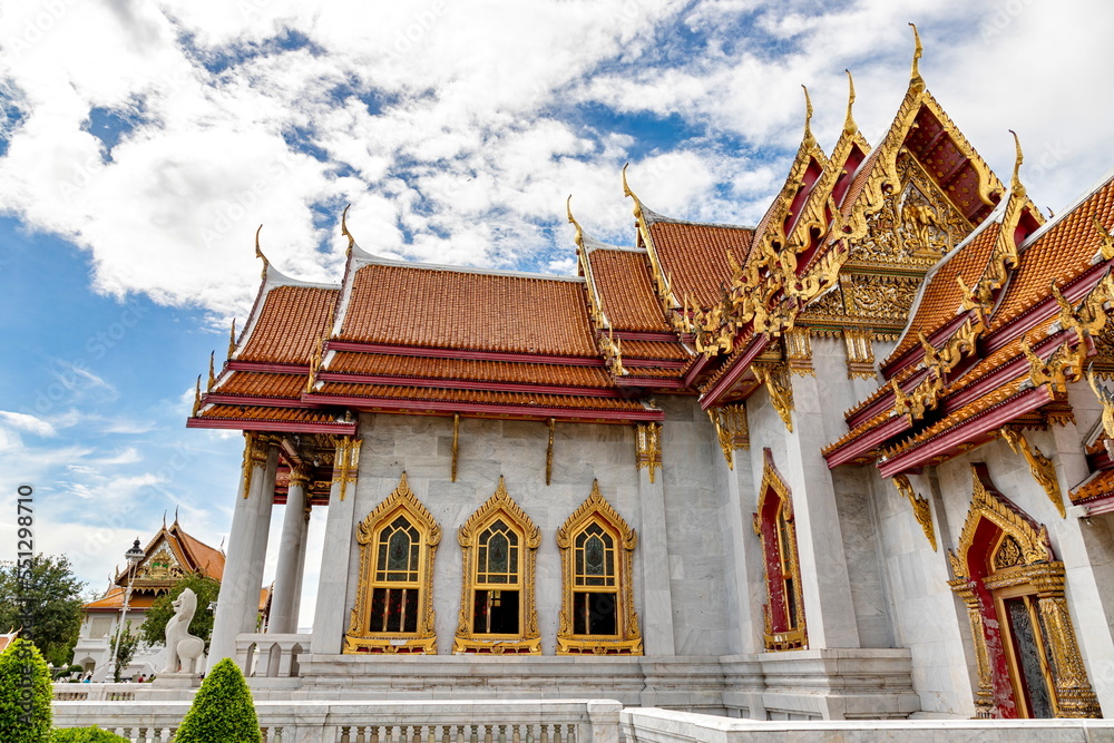 Wat Benchamabophit Dusit Wanaram (This temple is known as the Marble Temple) in Bangkok, blue sky and clouds. One of the most beautiful temples in Thailand Favorite destination in Bangkok. Daytime.