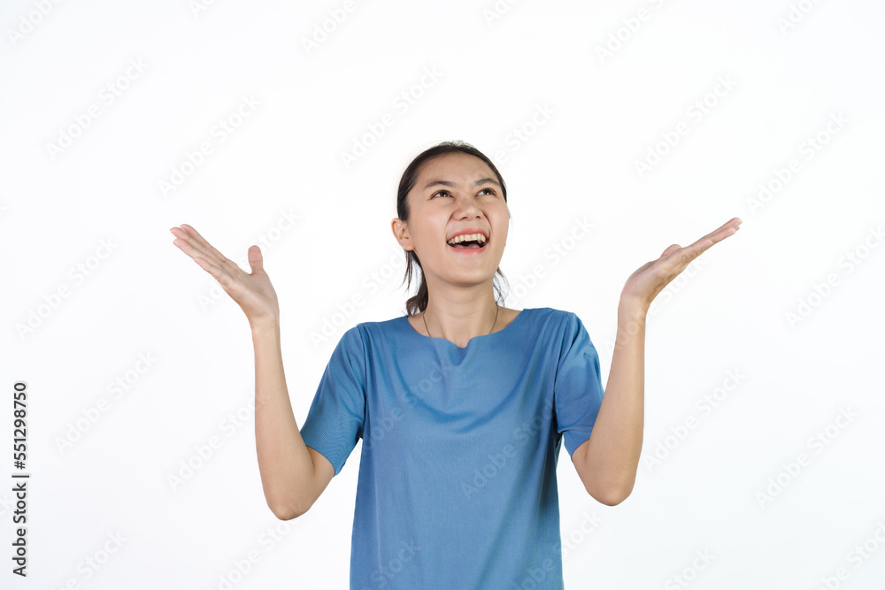 Beautiful Asian woman in blue t-shirt isolated on white background. Palm up Beautiful Asian woman in blue t-shirt isolated on white background. Palm up