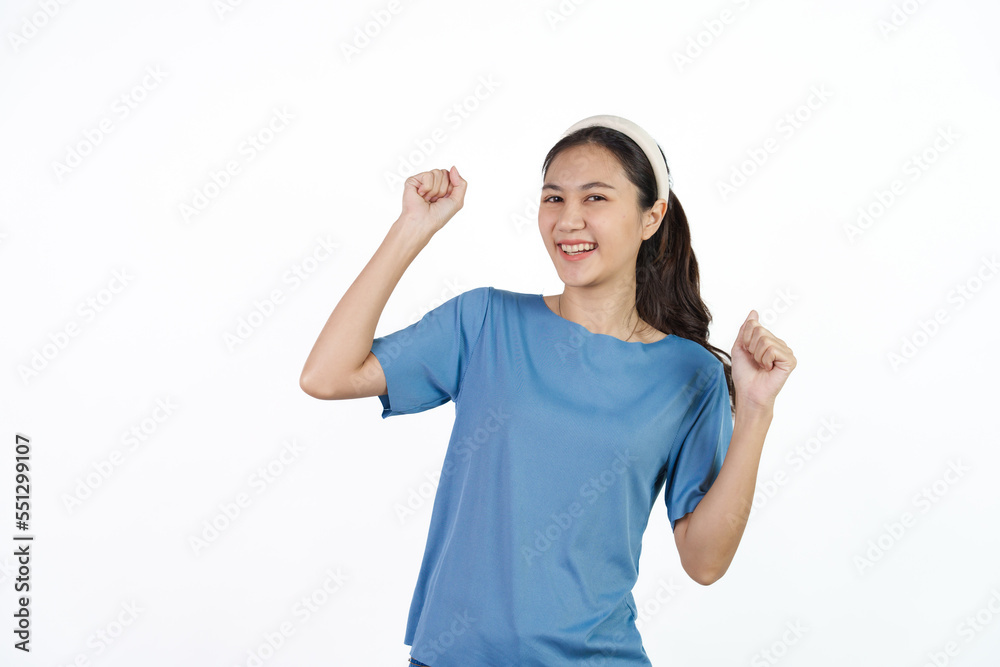 Beautiful Asian woman in blue t-shirt isolated on white background. Dancing Beautiful Asian woman in blue t-shirt isolated on white background. Dancing