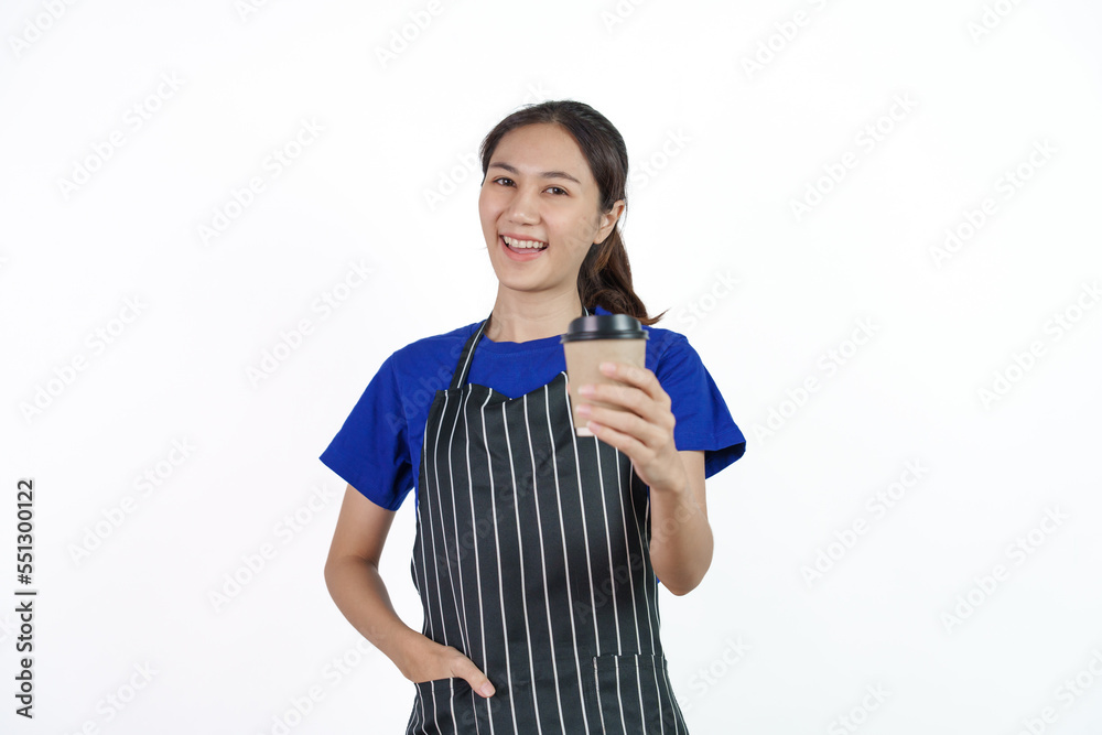 Excited asian coffee shop SME owner asian woman wearing blue t-shirt and black apron isolated on white background. Holding coffee cup Excited asian coffee shop SME owner asian woman wearing blue t-shirt and black apron isolated on white background. Holding coffee cup