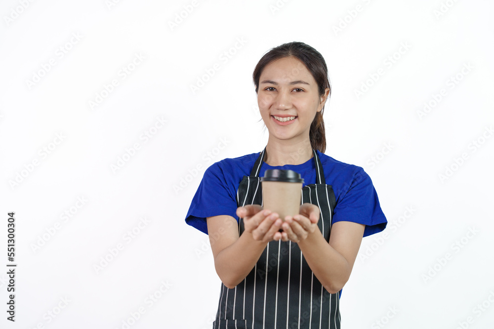 Excited asian coffee shop SME owner asian woman wearing blue t-shirt and black apron isolated on white background. Holding coffee cup Excited asian coffee shop SME owner asian woman wearing blue t-shirt and black apron isolated on white background. Holding coffee cup