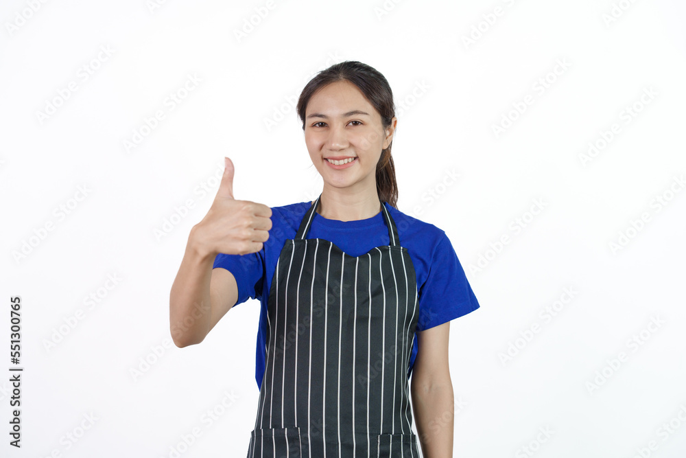 Excited asian coffee shop SME owner asian woman wearing blue t-shirt and black apron isolated on white background. Thumb up Excited asian coffee shop SME owner asian woman wearing blue t-shirt and black apron isolated on white background. Thumb up
