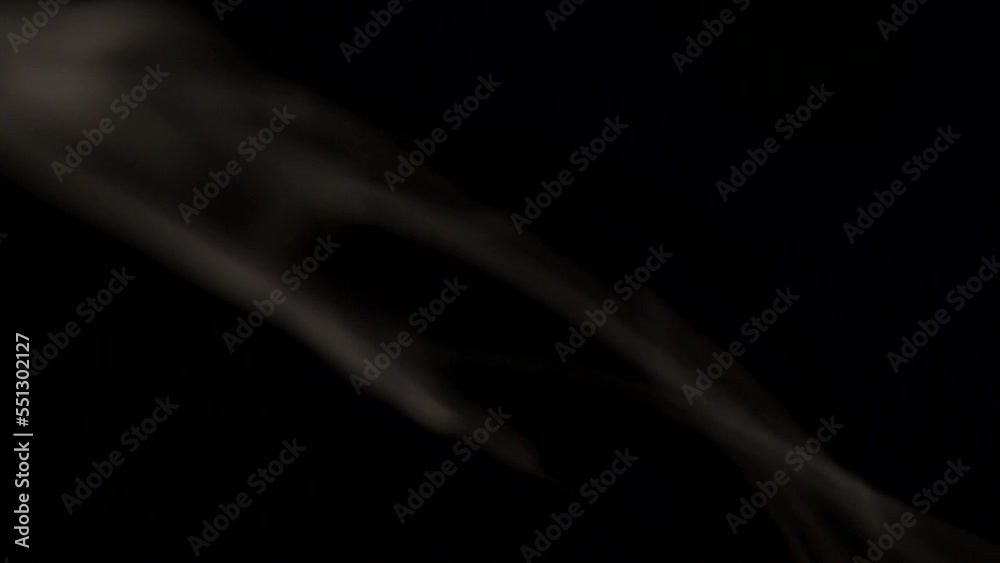 Curling tobacco smoke on a black background close-up Curling tobacco smoke on a black background close-up