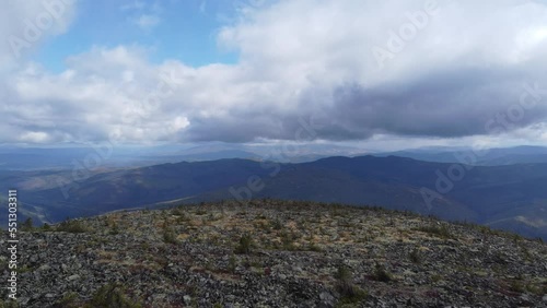 Flying over a flat surface in the mountains