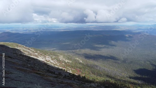 Flying over a flat surface in the mountains