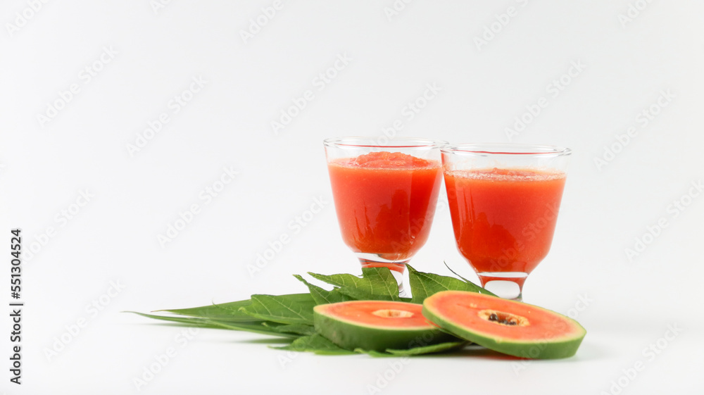 Papaya smoothie in glass jar and glasses on white background diet vegetarian healthy and freshness drink concept soft and selective focus Papaya smoothie in glass jar and glasses on white background diet vegetarian healthy and freshness drink concept soft and selective focus