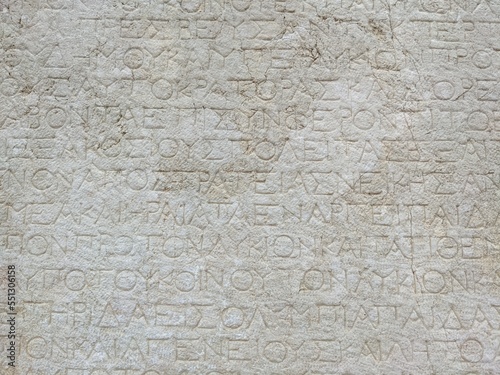 Ancient Greek inscriptions on an old surviving Greek monument in a ruined ancient city