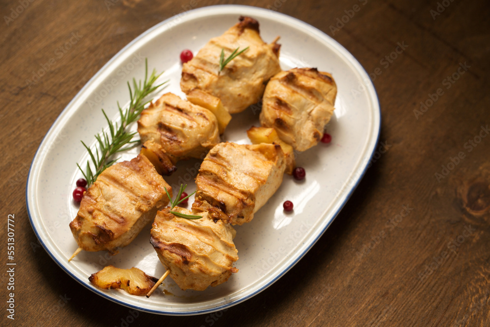 Chicken kebab with spices on a dark background Chicken kebab with spices on a dark background