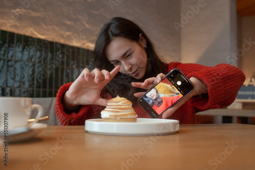 young girl in a cafe shoots food
