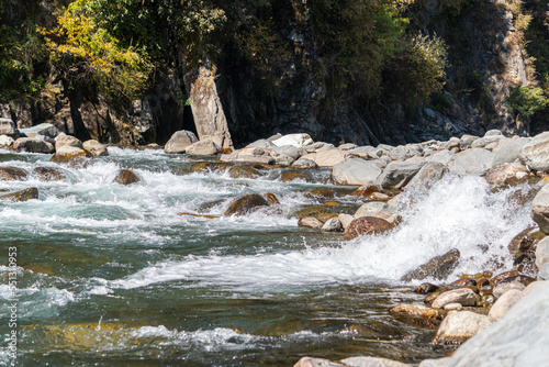 water splashing against stones in the river
