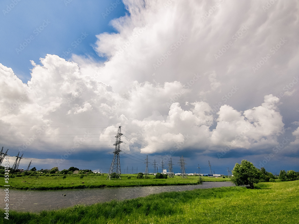 Thunderstorm clouds over industrial landscape Thunderstorm clouds over industrial landscape