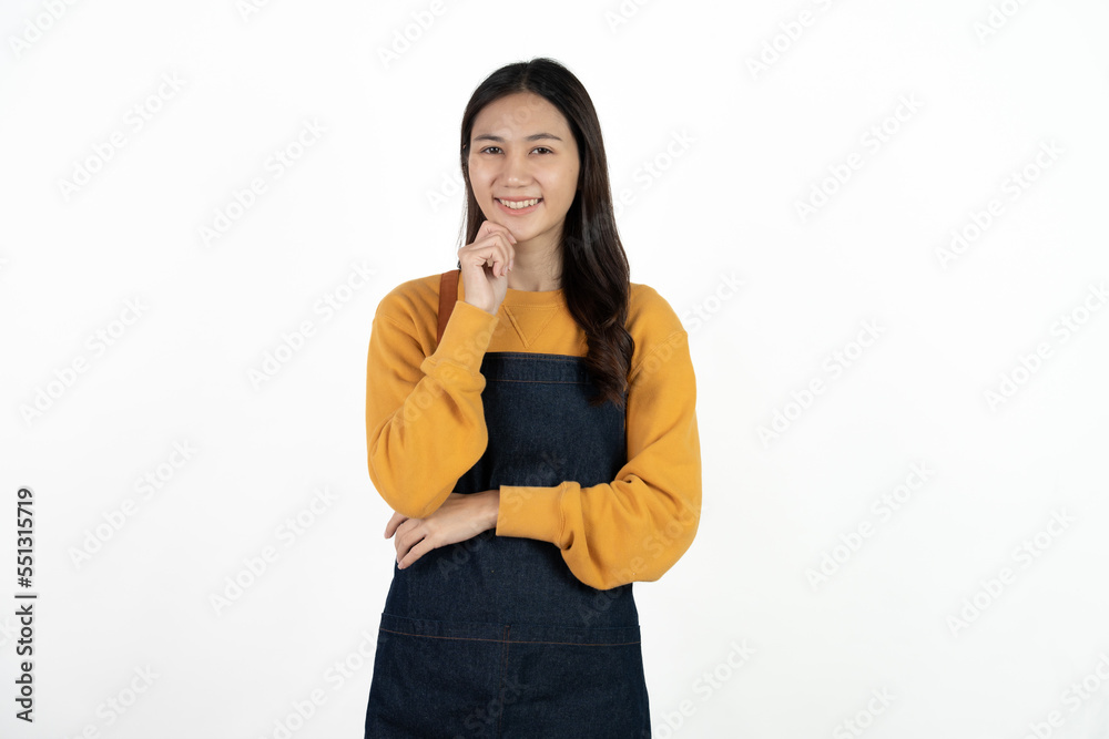 Young beautiful woman with apron standing on isolated white background pointing finger to blank space. Young beautiful woman with apron standing on isolated white background pointing finger to blank space.