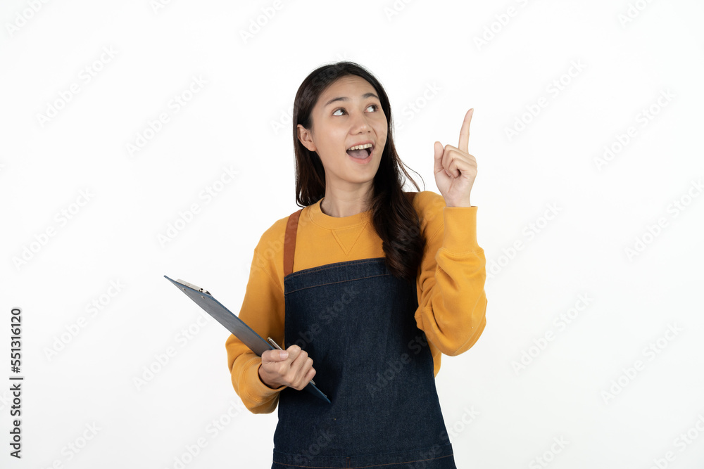 Happy young asian woman business owner wear apron and holding digital tablet for checking order from customer isolated on white background for SME franchise investment concept. Happy young asian woman business owner wear apron and holding digital tablet for checking order from customer isolated on white background for SME franchise investment concept.