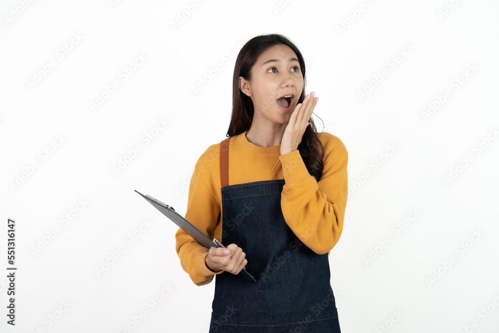 Happy young asian woman business owner wear apron and holding digital tablet for checking order from customer isolated on white background for SME franchise investment concept. Happy young asian woman business owner wear apron and holding digital tablet for checking order from customer isolated on white background for SME franchise investment concept.