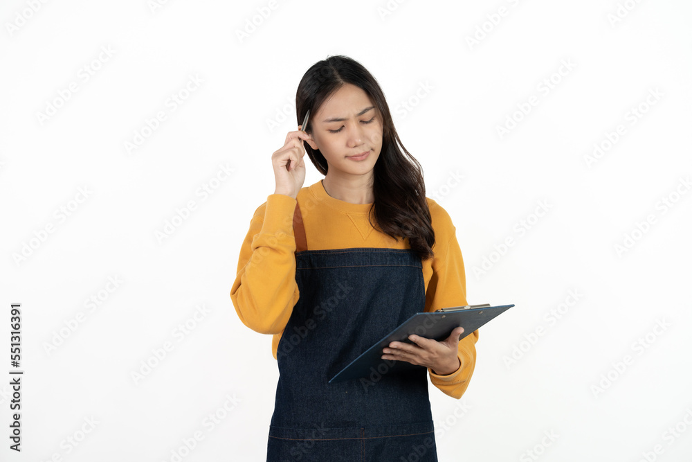 Happy young asian woman business owner wear apron and holding digital tablet for checking order from customer isolated on white background for SME franchise investment concept. Happy young asian woman business owner wear apron and holding digital tablet for checking order from customer isolated on white background for SME franchise investment concept.