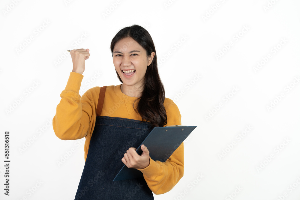 Happy young asian woman business owner wear apron and holding digital tablet for checking order from customer isolated on white background for SME franchise investment concept.
