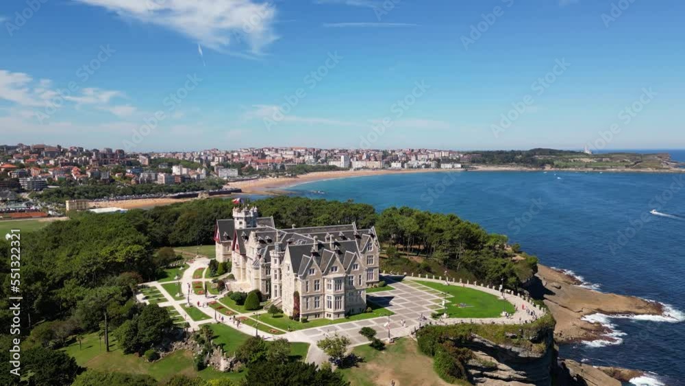 Magdalena Palace in Santander Spain with aerial view of the peninsula and the city with sunny beach in summer. 
