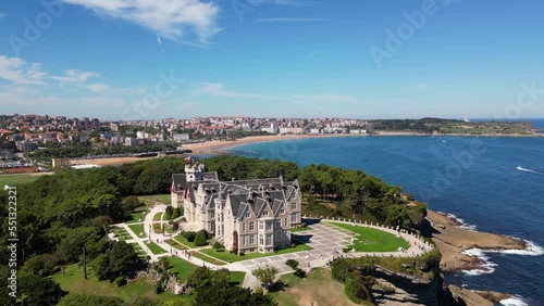 Magdalena Palace in Santander Spain with aerial view of the peninsula and the city with sunny beach in summer.  photo