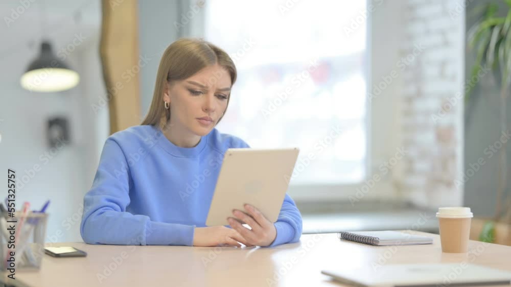 Shocked Woman Reacting to Loss on Digital Tablet Shocked Woman Reacting to Loss on Digital Tablet