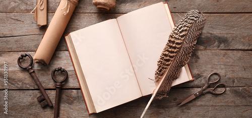 Open old book, scrolls, fea...