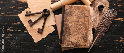 Old book, scrolls, feather ...