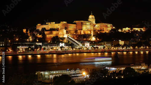 Night shot, long exposure photography, famous historical Buda Castle in illuminated at night, Royal Palace view by the Danube river, Budapest, Hungary