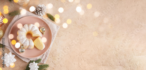 Tasty Christmas cake and decor on beige background with space for text