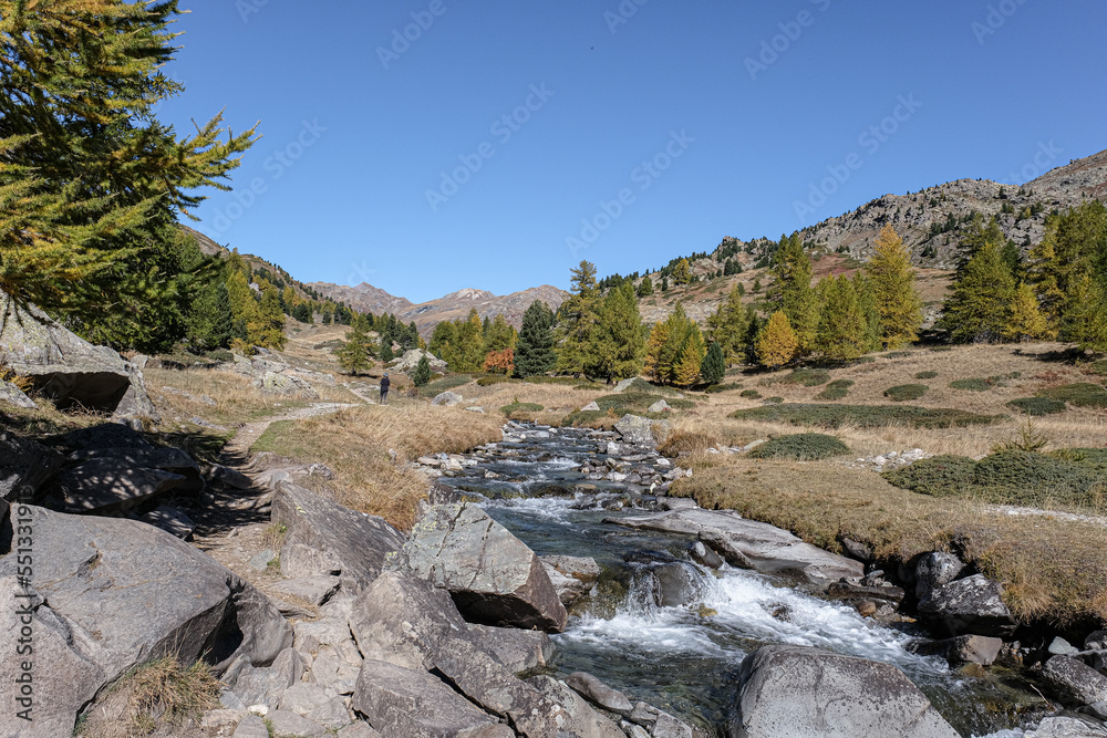 View of Claree river in Claree valley with Massif de Cerces mountains on either site, near Navache village and Briancon, Hautes-Alpes department, France View of Claree river in Claree valley with Massif de Cerces mountains on either site, near Navache village and Briancon, Hautes-Alpes department, France