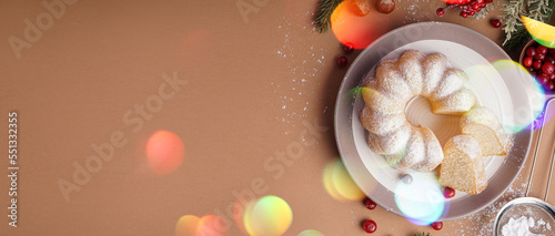 Plate with tasty Christmas cake on beige background with space for text