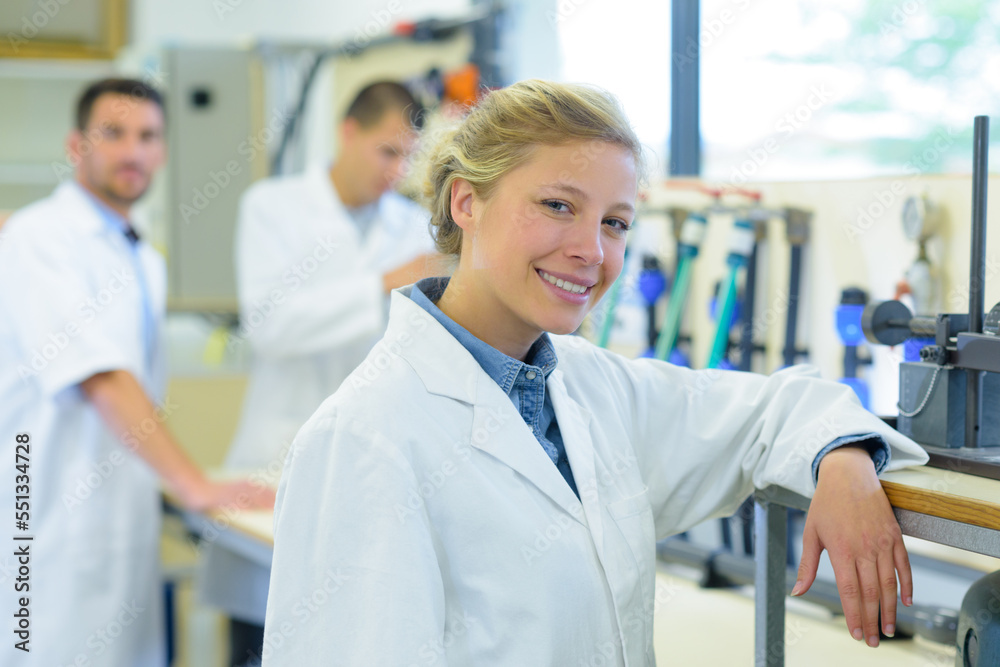 portrait of young female scientist in lab