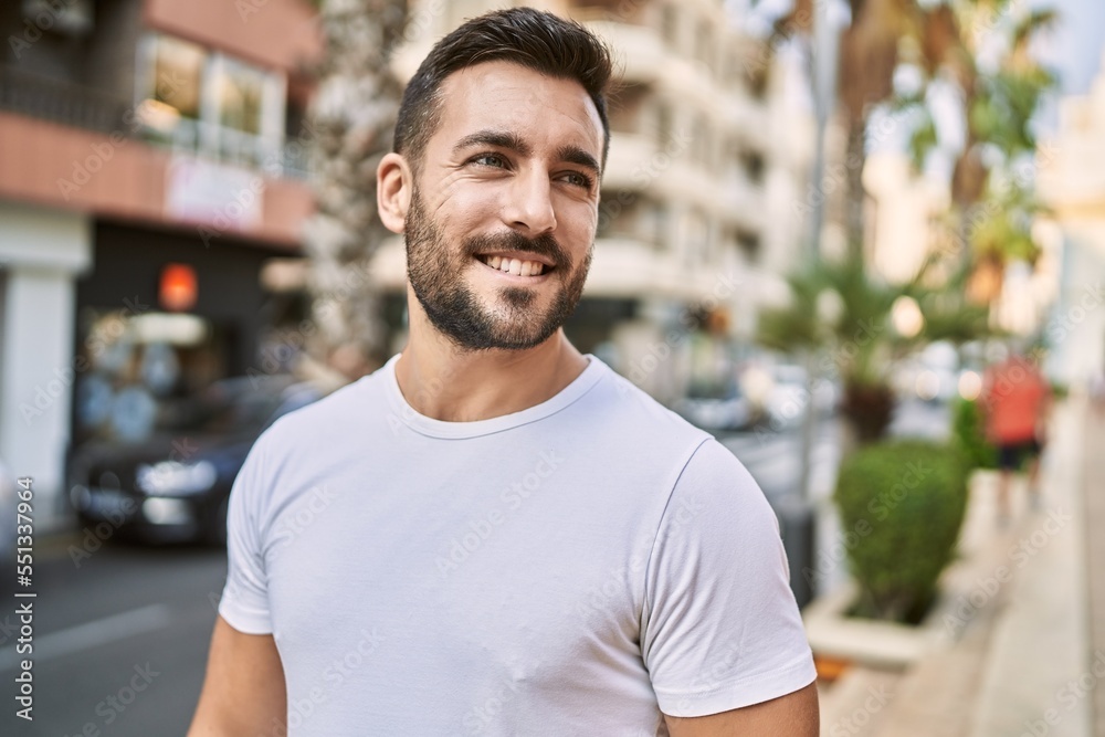 Young hispanic man smiling confident walking at street Young hispanic man smiling confident walking at street
