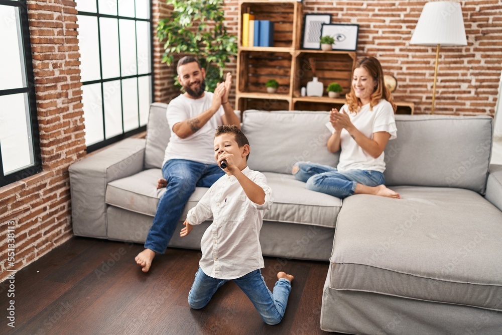 Fototapeta premium Family singing song using microphone at home