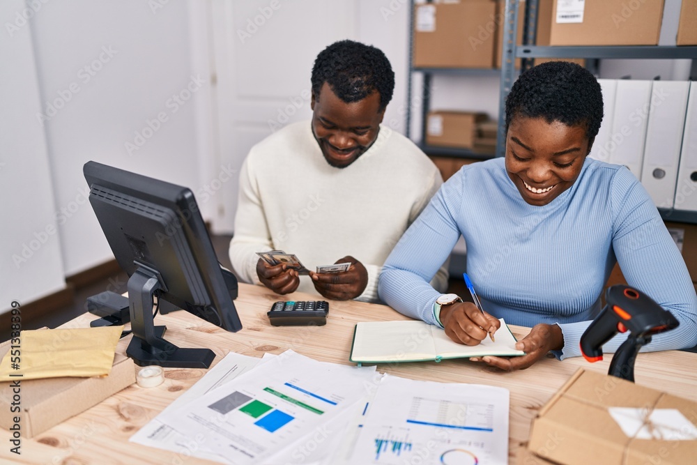 Man and woman ecommerce business workers accounting at office
