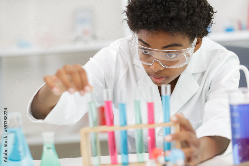 female researcher with two glasses in the lab female researcher with two glasses in the lab