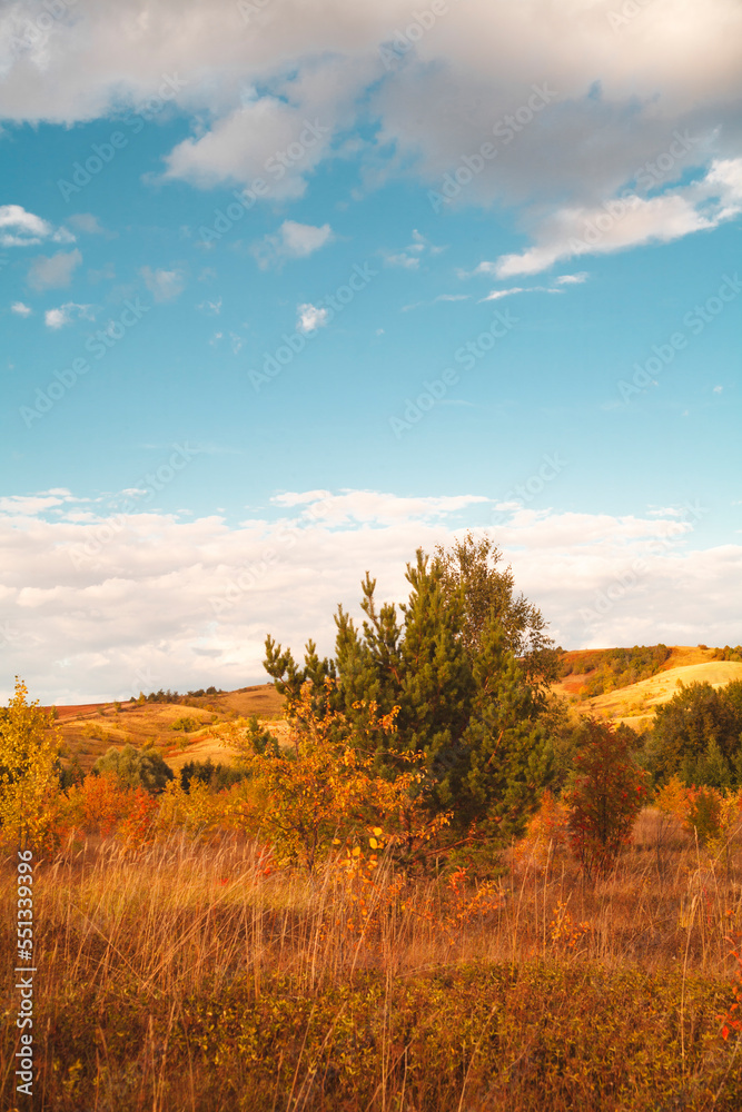 Beautiful mountain landscape. Mountains in the rays of the setting sun, in autumn.Green forest. Blue sky with beautiful clouds. park. Russia. Beautiful mountain landscape. Mountains in the rays of the setting sun, in autumn.Green forest. Blue sky with beautiful clouds. park. Russia.