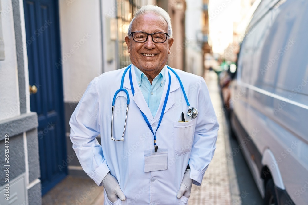 Senior man wearing doctor uniform standing at street Senior man wearing doctor uniform standing at street