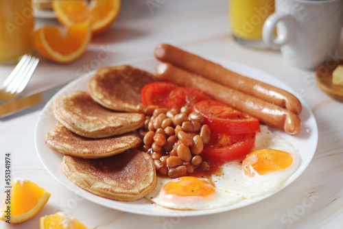 Traditional British breakfast with sausages and beans 