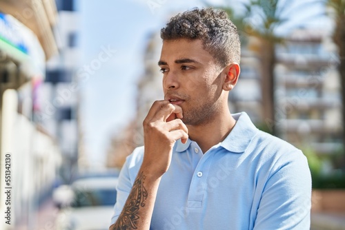 African american man standing with doubt expression at street